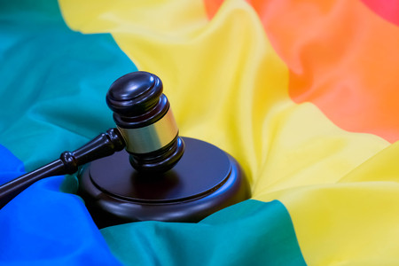 Hammer and gavel against against rainbow flag. gay flag backgroundの写真素材