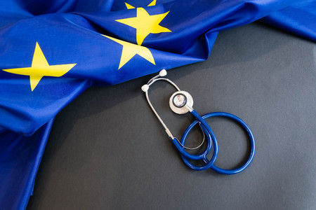 Cost of health care concept, stethoscope and calculator on document and eu flagの写真素材