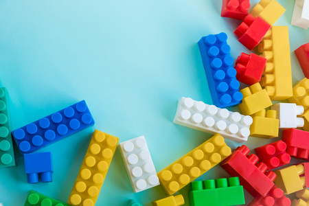 Close up Children plastic constructor. on a blue background stripe background. Developing toys.の写真素材