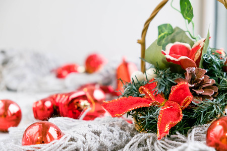 Red Christmas decoration with glass balls, fir branch and candleの写真素材