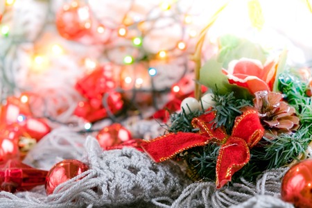 Merry Christmas and Happy Holidays! Red star, Christmas baubles and garland lights on old dark wooden rustic background.の写真素材