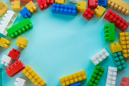 Close up Children plastic constructor. on a blue background stripe background. Developing toys.の写真素材