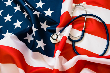 Close-up Photo Of Stethoscope On American Flagの写真素材