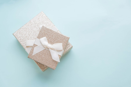 christmas or new year frame composition. christmas decorations in gold colors on white background with empty copy space for text. holiday and celebration concept for postcard or invitation. top viewの写真素材