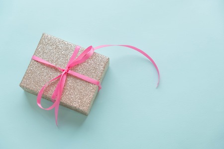 Present boxes on blue background greeting card holidays concept.の写真素材