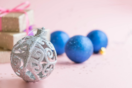 Gold gift box and a small Bell tied a red bo lay on the wood White and pine Christmas dayの写真素材