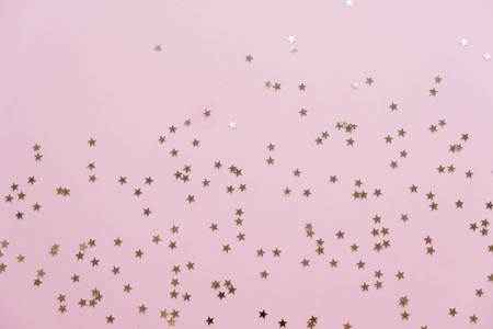 sparkling stars on a pink backgroundの写真素材