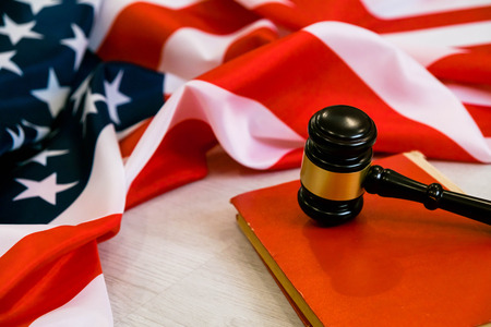 Wooden gavel. usa legal concept, judge wooden gavel and legal book with usa flag.の写真素材