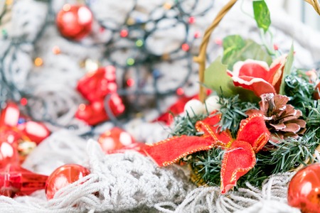 Merry Christmas and Happy Holidays! Red star, Christmas baubles and garland lights on old dark wooden rustic background.の写真素材