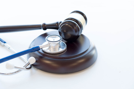 Gavel and stethoscope. medical jurisprudence. legal definition of medical malpractice. attorney. common errors doctors, nurses and hospitals make.の写真素材