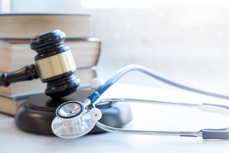 Gavel and stethoscope. medical jurisprudence. legal definition of medical malpractice. attorney. common errors doctors, nurses and hospitals make.の写真素材