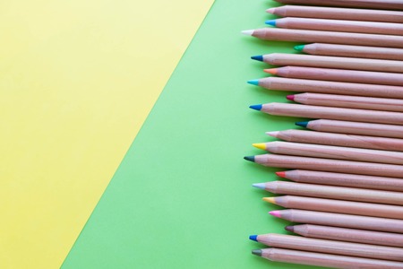 background from color pencils on green paperの写真素材