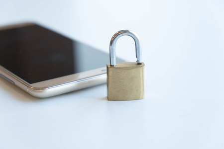 Telephone with lock, concept of protection of personal information. mobile phone security. chained smartphone. Security of smartphone. Low key lock, internet security smartphone data theft conceptの写真素材