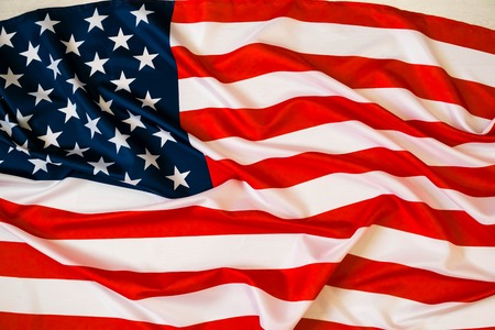 Flag of the USA. Closeup of rippled American flag. nited States of America flag. Image of the american flag flying in the windの写真素材