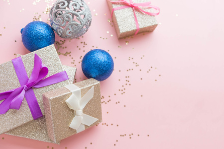 Gold gift box and a small Bell tied a red bo lay on the wood White and pine Christmas dayの写真素材
