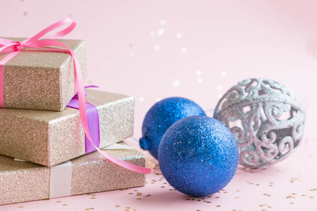 christmas or new year frame composition. christmas decorations in gold colors on white background with empty copy space for text. holiday and celebration concept for postcard or invitation. top viewの写真素材