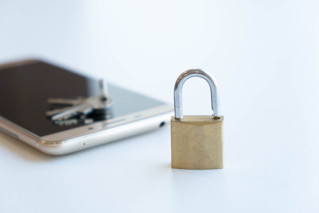 Telephone with lock, concept of protection of personal information. mobile phone security. chained smartphone. Security of smartphone. Low key lock, internet security smartphone data theft conceptの写真素材
