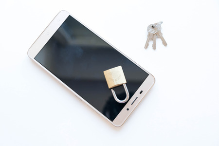 Telephone with lock, concept of protection of personal information. mobile phone security. chained smartphone. Security of smartphone. Low key lock, internet security smartphone data theft conceptの写真素材
