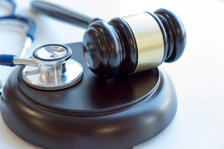 Gavel and stethoscope. medical jurisprudence. legal definition of medical malpractice. attorney. common errors doctors, nurses and hospitals make.の写真素材