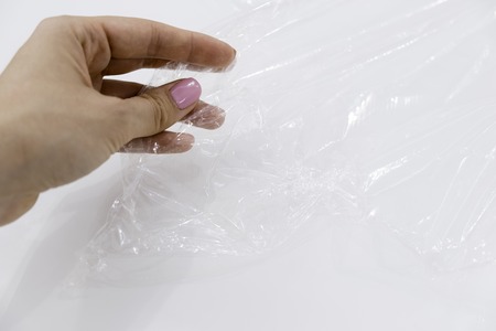 wrapping plastic transparent food film on white background.の写真素材