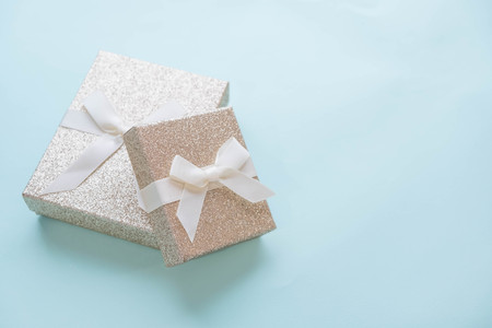 Creative minimal Christmas concept. winter vacation layout with gift boxes table space in middle design. Flat lay. Top view. New Year holiday backgroundの写真素材