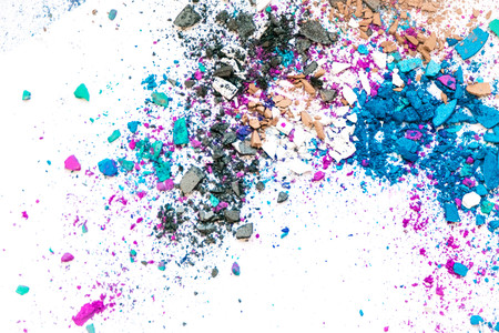 Samples of dry blush, powder, bronzers and highlighter scattered in a line isolated on a white backgroundの写真素材