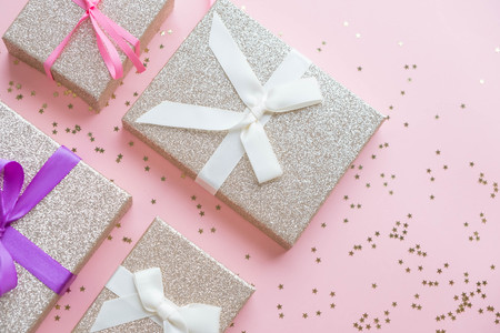 Creative minimal Christmas concept. winter vacation layout with gift boxes table space in middle design. Flat lay. Top view. New Year holiday backgroundの写真素材