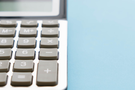 Office leather desk table with calculator and pen. Top view with copy spaceの写真素材