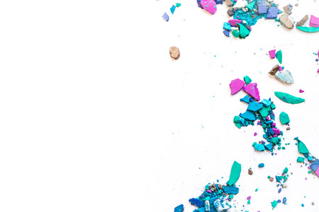 Samples of dry blush, powder, bronzers and highlighter scattered in a line isolated on a white backgroundの写真素材