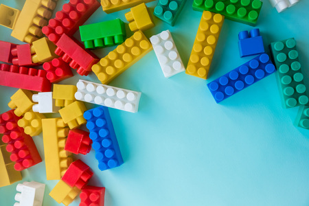 Close up Children plastic constructor. on a blue background stripe background. Developing toys.の写真素材