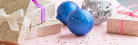 Gold gift box and a small Bell tied a red bo lay on the wood White and pine Christmas dayの写真素材