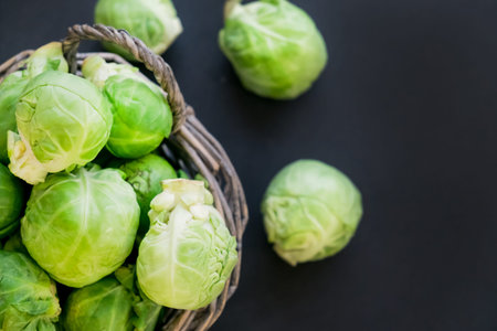 fresh raw brussels sprouts on a wooden table