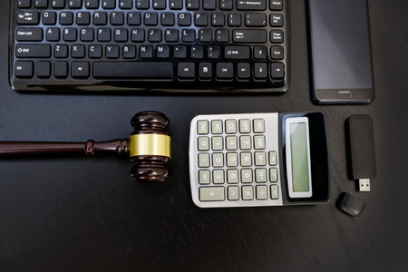 justice and law concept.Lawyer workplace with laptop and documents with dark wooden