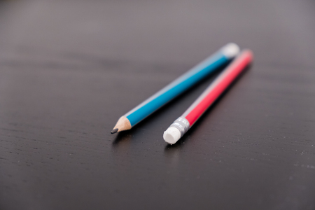 Closeup of pencil eraser on wooden table, soft focus. Mistake erase concept. correct or erase past errorsの写真素材