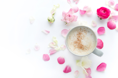 Romantic background with cup of coffee flowers over white table. Soft photo. Greeting card style. place for text, Top view flat lay with copy space for slogan or textの写真素材