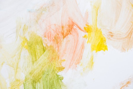 Child scribble on the wall colored pencils scribbles on a white wall made by a little kid that could pass as abstract work.の写真素材