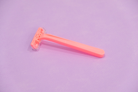 pink womens disposable razors . Hygiene skin body care concept. Hair removal. Focus on razorの写真素材