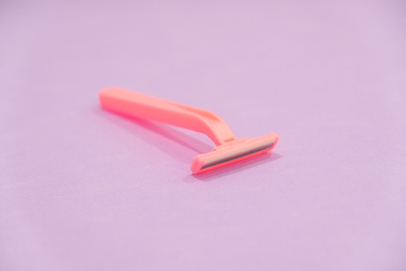 pink womens disposable razors . Hygiene skin body care concept. Hair removal. Focus on razorの写真素材