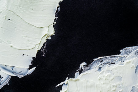 Smear clay mask for face and body. texture is smeared isolated on a black background. natural...