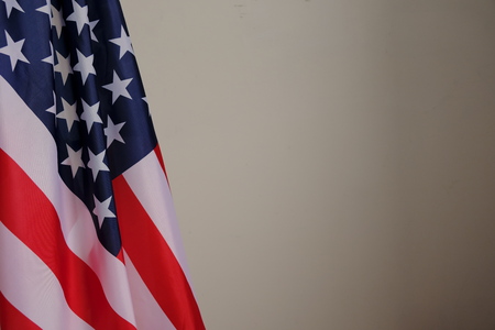Closeup of American flag on plain backgroundの写真素材