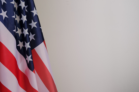 Closeup of American flag on plain backgroundの写真素材