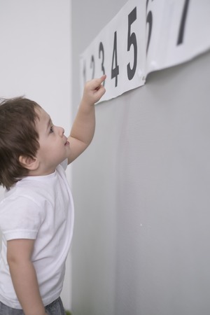 Cute little boy learn numbers at home. math for kids. two years, Asian babe. childhood development. Smart child learn to count to tenの写真素材