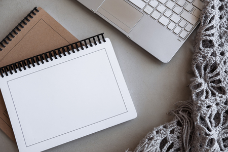 Selective focus table : Businessman hand write notebook, mobile phone, laptop, and pen on the wooden table.working Business concept with effect light addedの写真素材