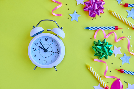 yellow background, the concept of party time, an invitation to a birthday or other celebrationの写真素材