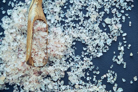 Himalayan pink salt in crystals above a gray stoneの写真素材
