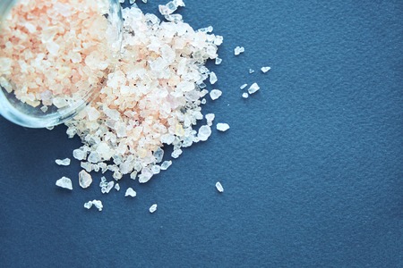 bowl of pink himalayan salt on dark table, top view, copy spaceの写真素材