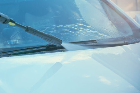 Summer Car Washing. Cleaning Car Using High Pressure Water.の写真素材