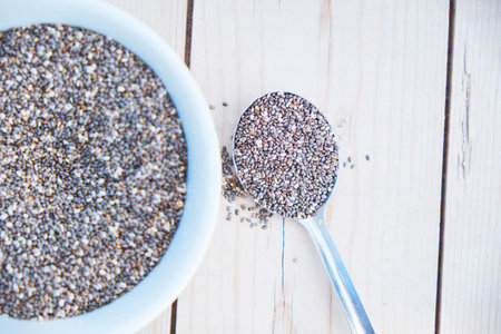 Healthy Chia seeds in a wooden spoon the table close-up. horizontalの写真素材