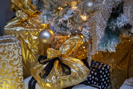 Christmas decoration. Christmas presents in boxes. Golden and brownish aesthetics.