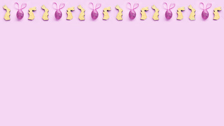 colorful background for easter, wooden bunnies and Easter eggs with ears